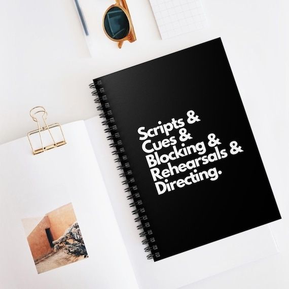 Black spiral notebook labeled